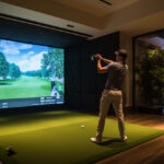 Golf playing into into drop down bay screen